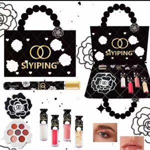 Set perfume, lipgloss and makeup pallet